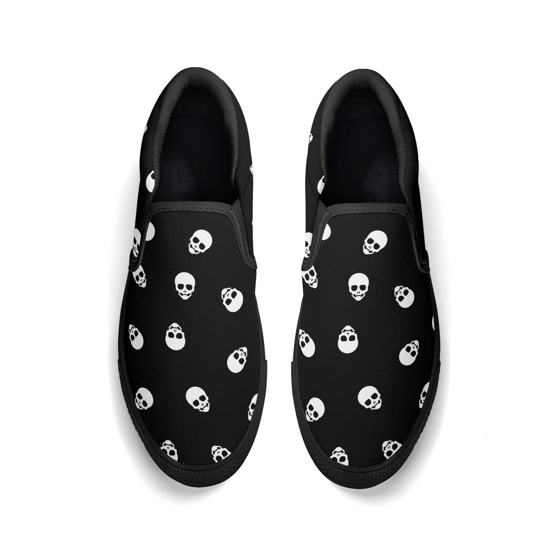 Black Canvas Slip-On Sneakers with a Killer White Skull Pattern - Warning: May cause sudden outbreaks of shoe-envy among onlookers!