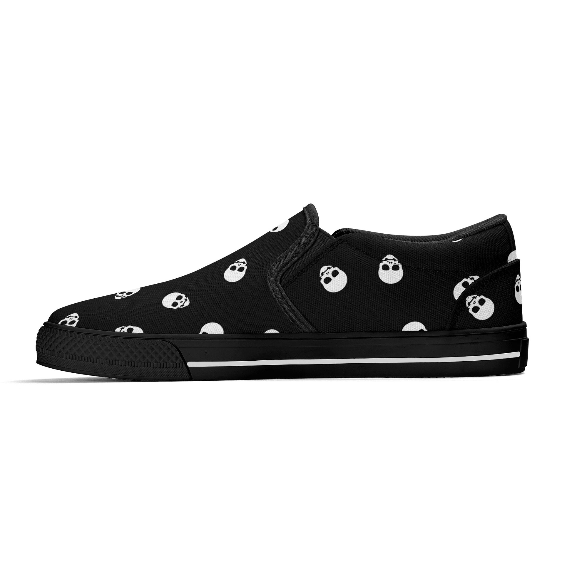 Black Canvas Slip-On Sneakers with a Killer White Skull Pattern - Warning: May cause sudden outbreaks of shoe-envy among onlookers!