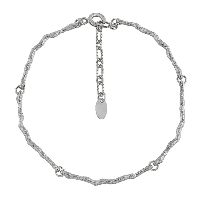 Modern 925 sterling silver bracelet with an irregular branch design, perfect for adding a touch of nature-inspired elegance to any outfit.