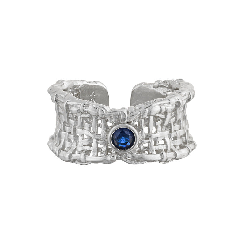 Elegant 925 sterling silver ring featuring a hollow weave net design with a stunning blue cubic zirconia at the center.