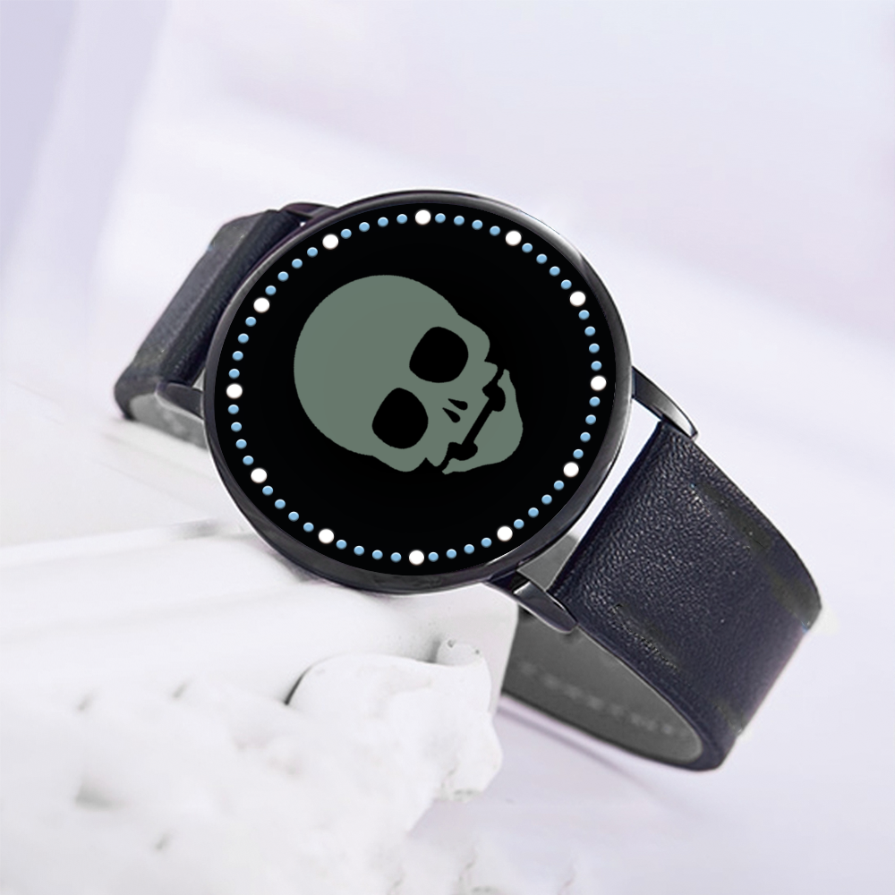 Chic black LED touch screen watch with a unique sage green skull face, blending contemporary technology with distinctive style.