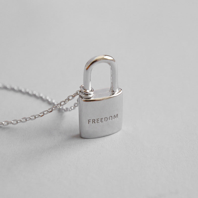 Sleek 925 sterling silver necklace featuring a freedom lock pendant, symbolizing liberation and elegance in a chic design.