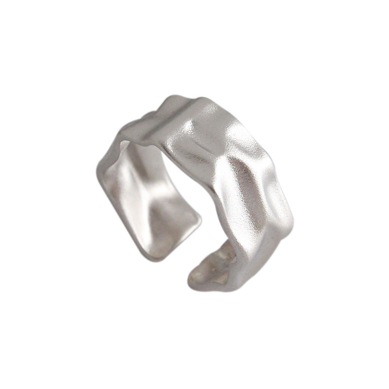 Elegant 925 sterling silver ring with a unique, irregular textured surface, offering a modern twist on a classic design.