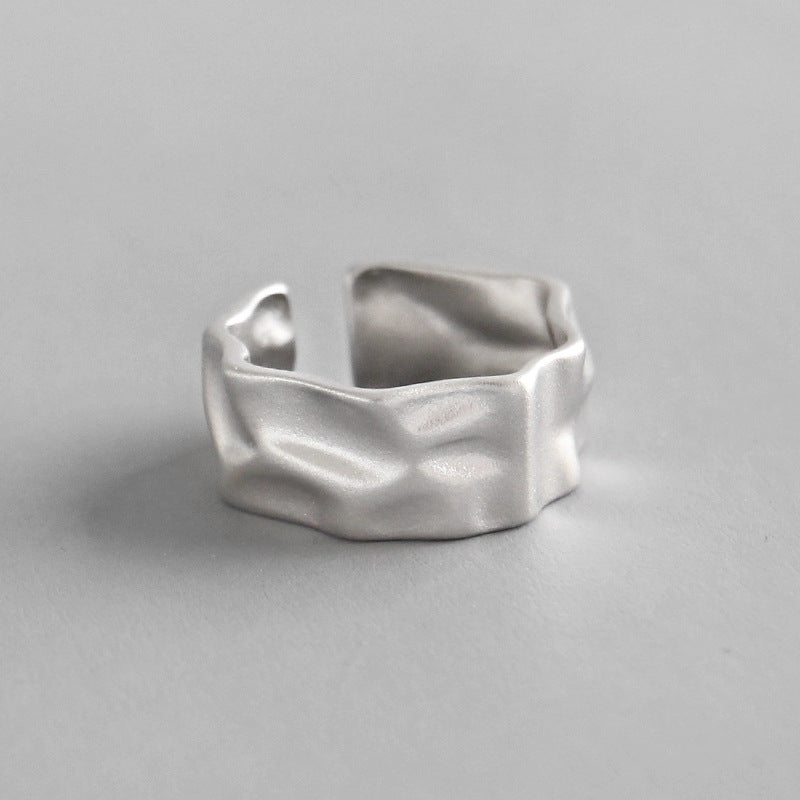 Elegant 925 sterling silver ring with a unique, irregular textured surface, offering a modern twist on a classic design.